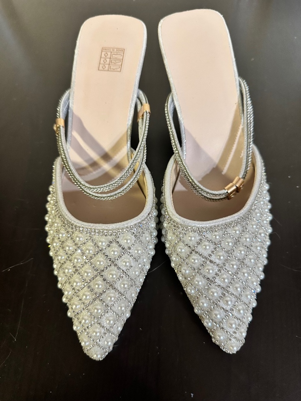 These are silver, pointed-toe kitten heel mules, Size 37/ 6.5 women’s